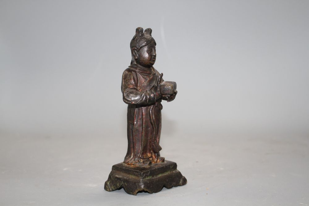 A 17th century Chinese bronze figure, with remnants of polychrome lacquer, h.16cm